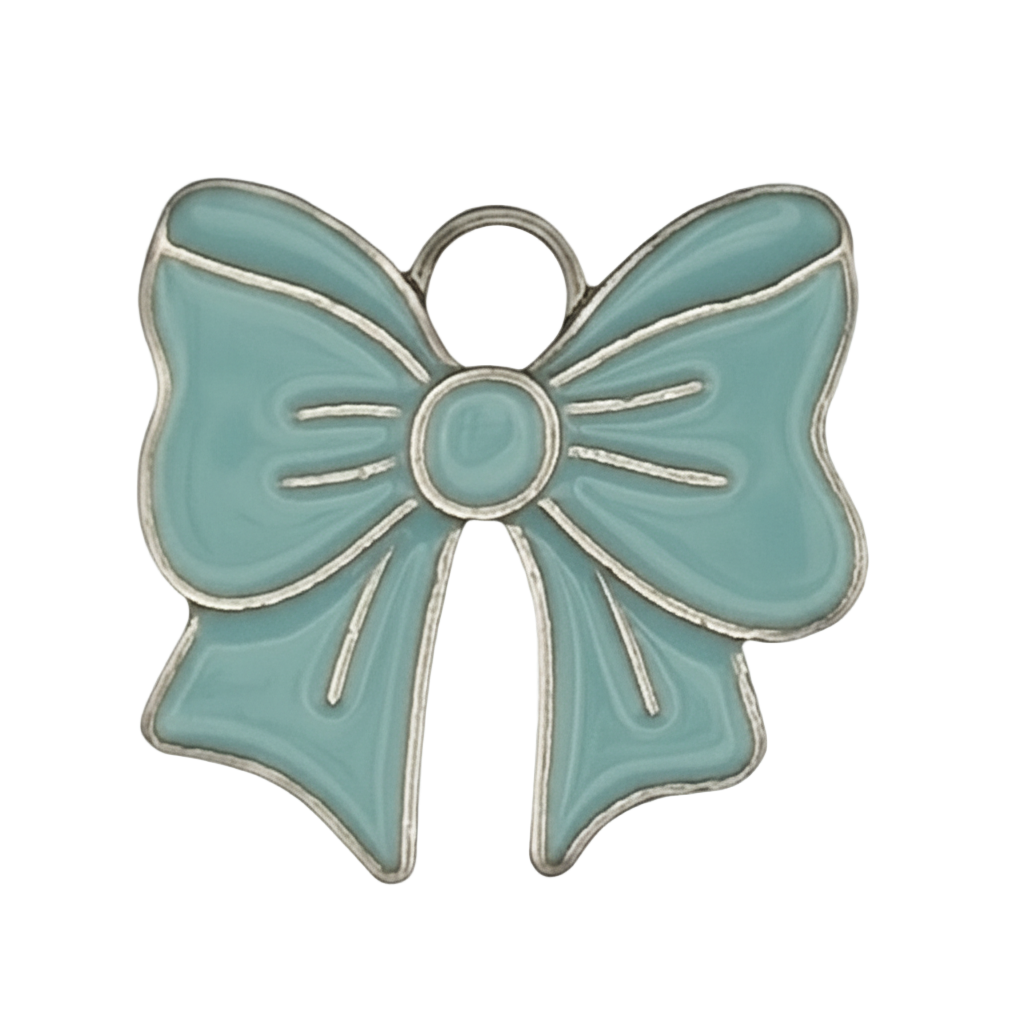 close-up of teal enamel bow charm with silver outline on black background