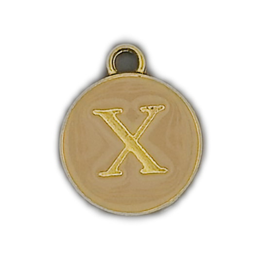 close-up of round gold letter X charm with beige background