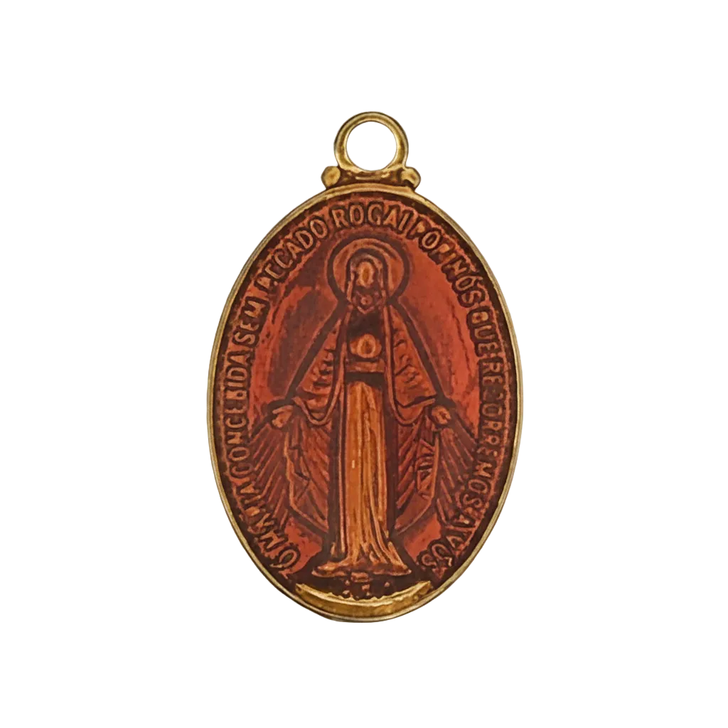 Close-up of an oval red enamel miraculous medal charm with a gold-tone edge and a figure of Mary.