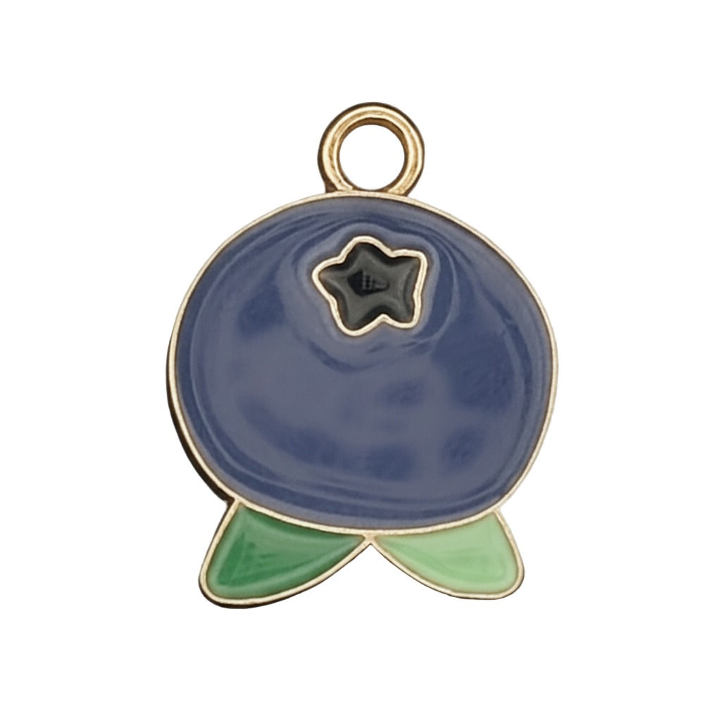 close-up of blueberry-shaped enamel charm with green leaves and gold-tone outline