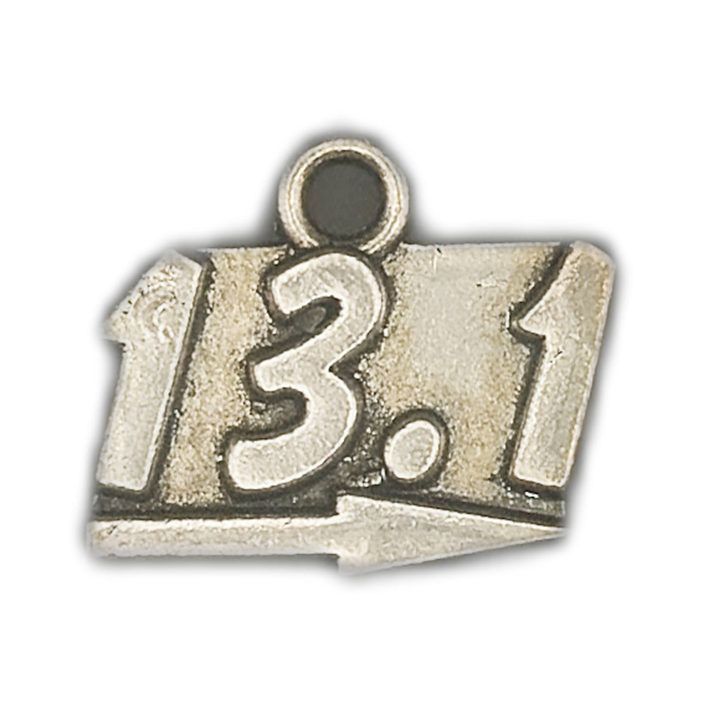close-up of antiqued silver charm with 13.1 and a right-pointing arrow