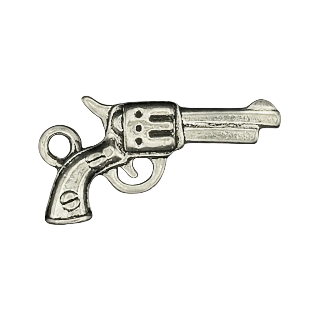 close-up of silver revolver charm on black background