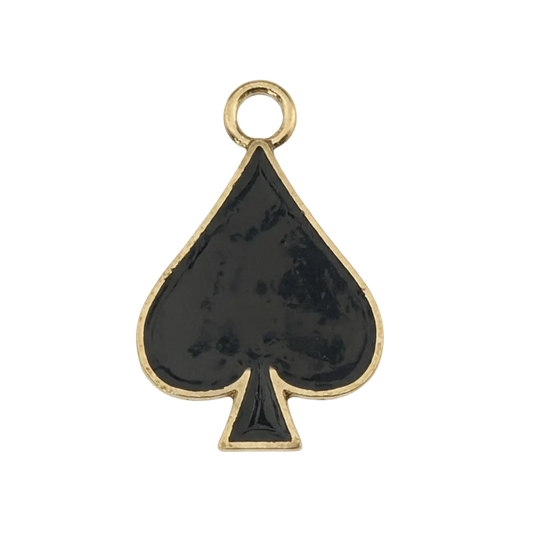 close-up of a black enamel spade charm with a gold outline on a black background