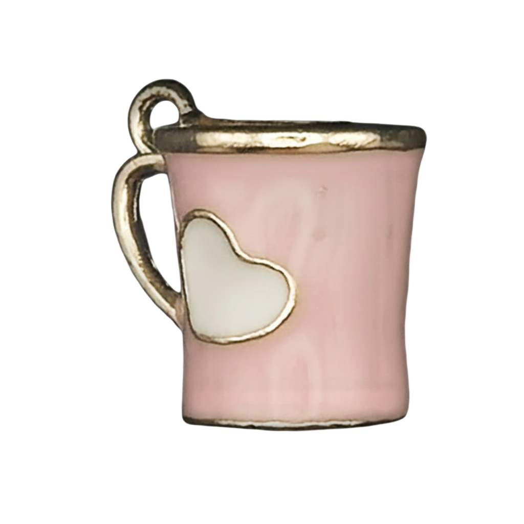 close-up of pink mug charm with white heart and gold trim