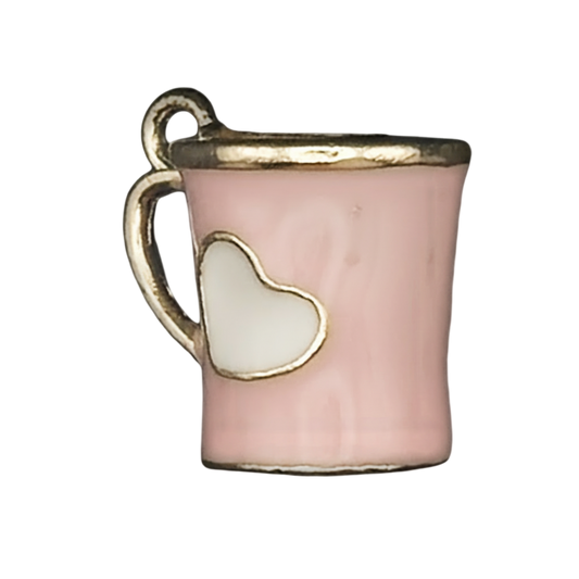 close-up of pink mug charm with white heart and gold trim