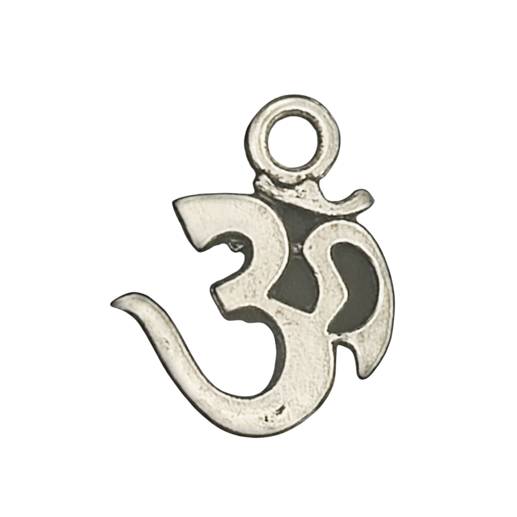 close-up of small silver Om symbol charm on black background
