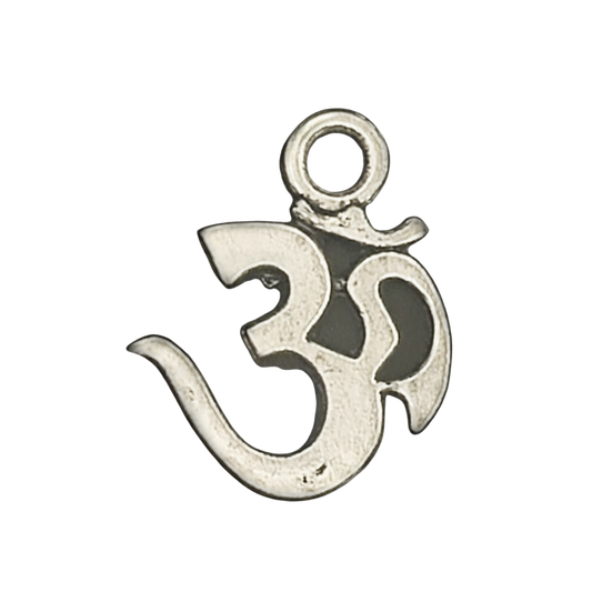 close-up of small silver Om symbol charm on black background