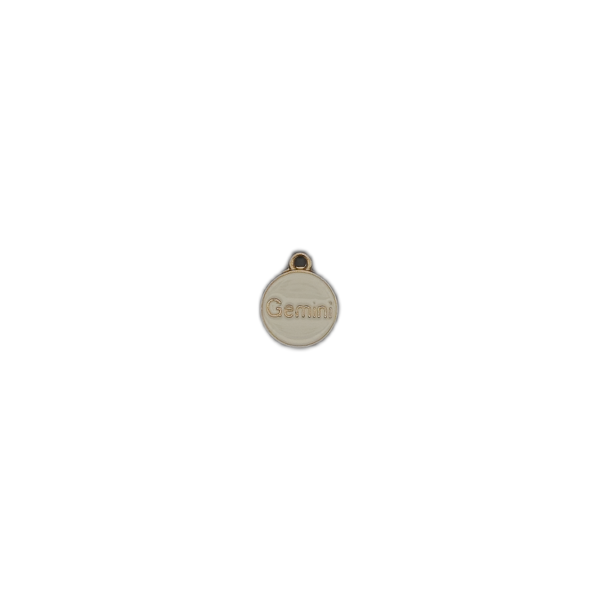small round cream and gold Gemini charm centered on black background
