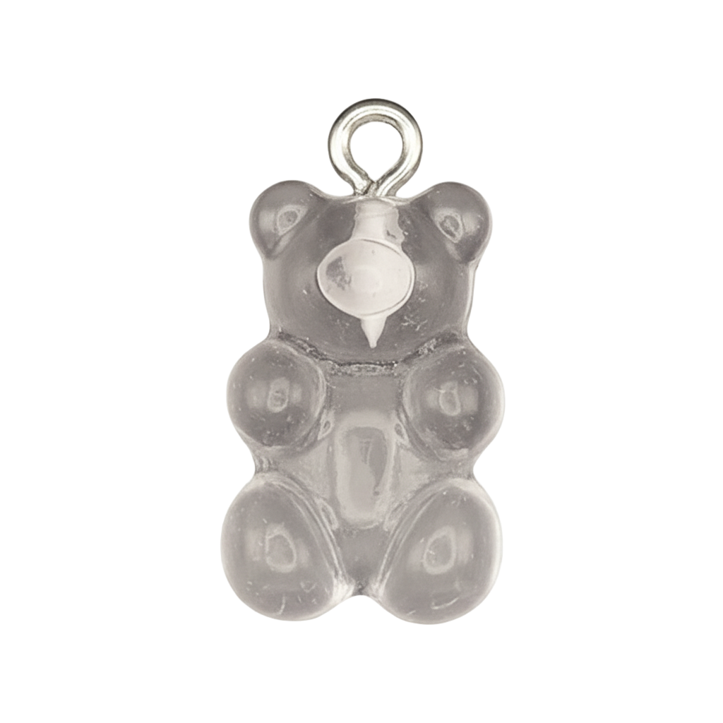 close-up of a translucent gray gummy bear charm on a black background