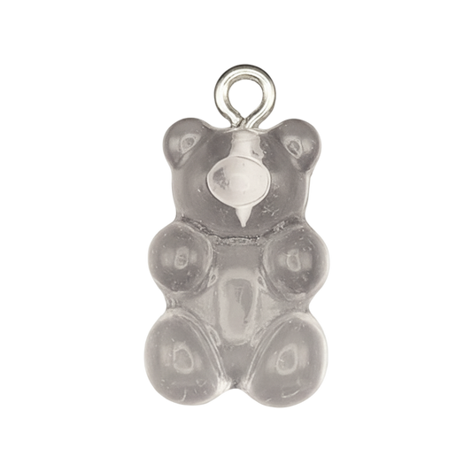 close-up of a translucent gray gummy bear charm on a black background