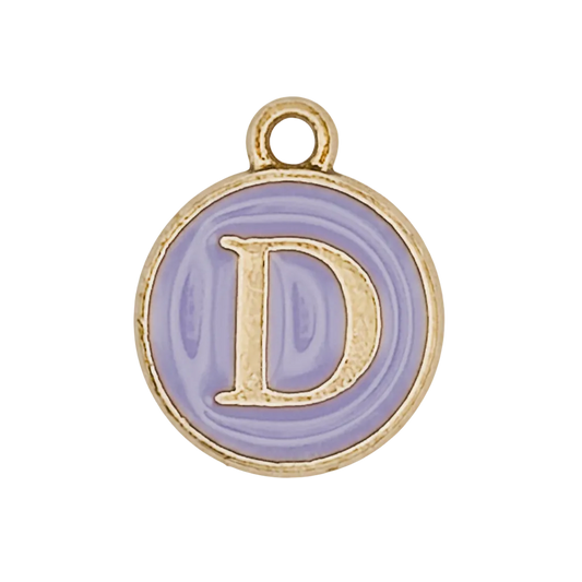 Close-up of round lavender enamel charm with gold letter D and gold rim.