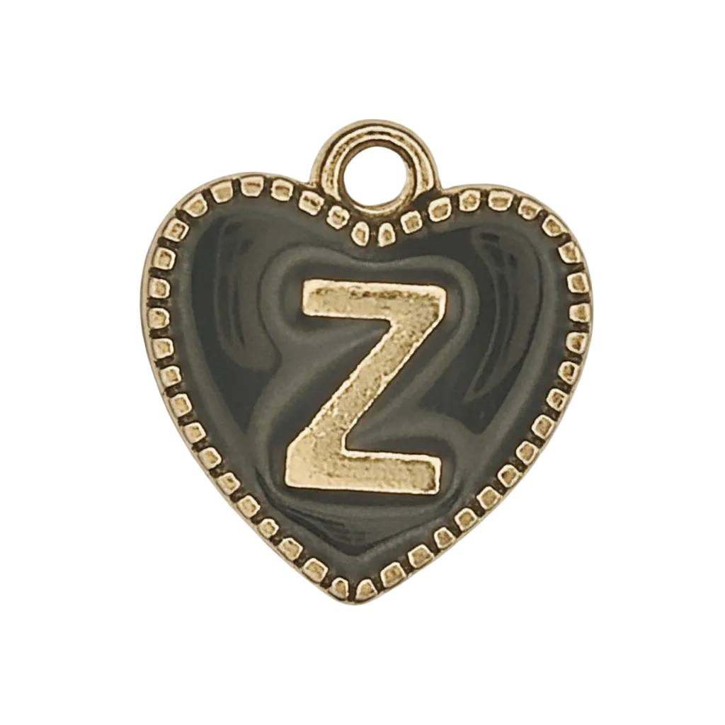 close-up of heart-shaped black charm with gold letter Z and dotted border