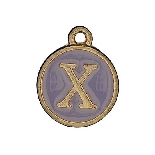 Close-up of a round gold-tone charm with lavender enamel and a raised letter X.