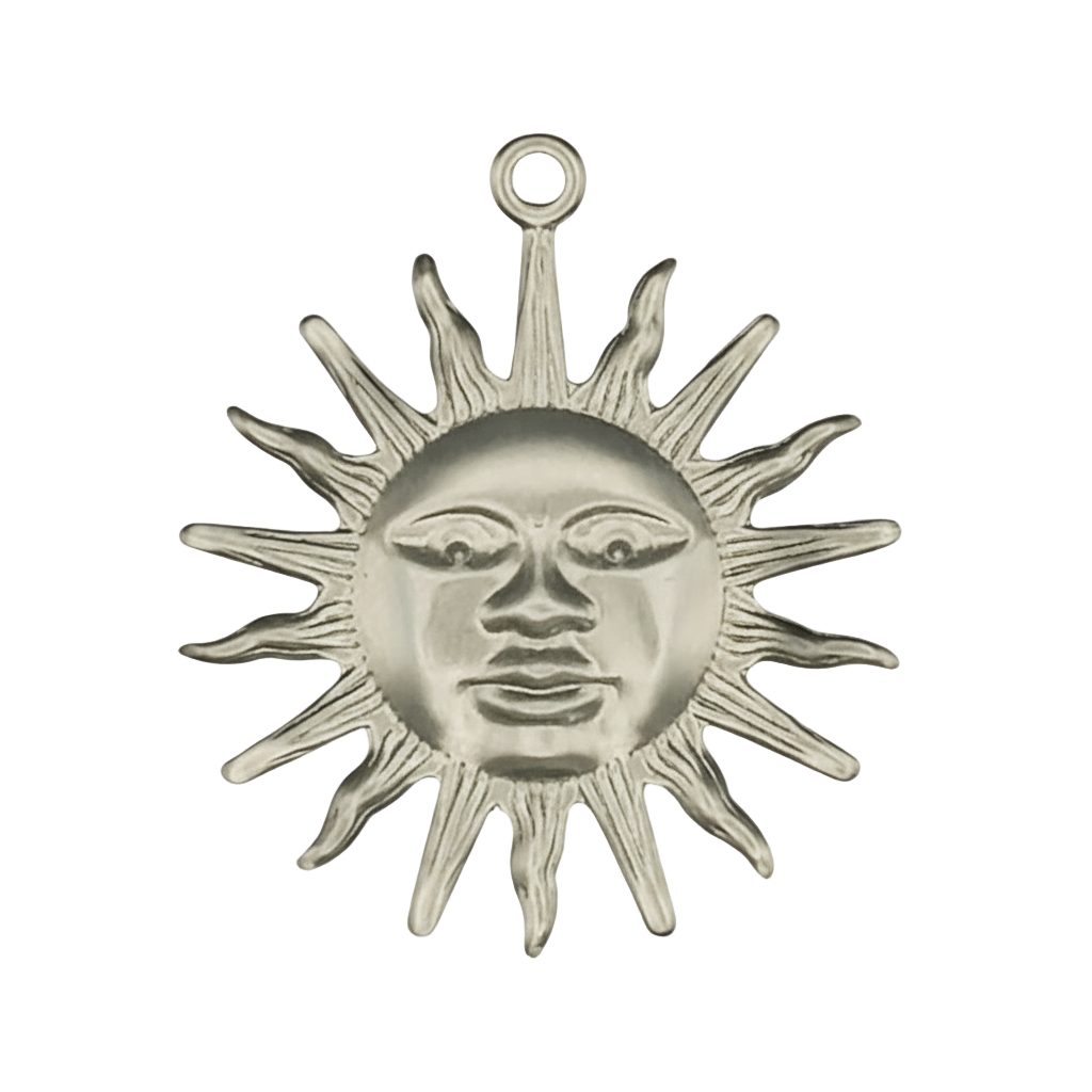 close-up silver-tone sun face charm with pointed rays on black background