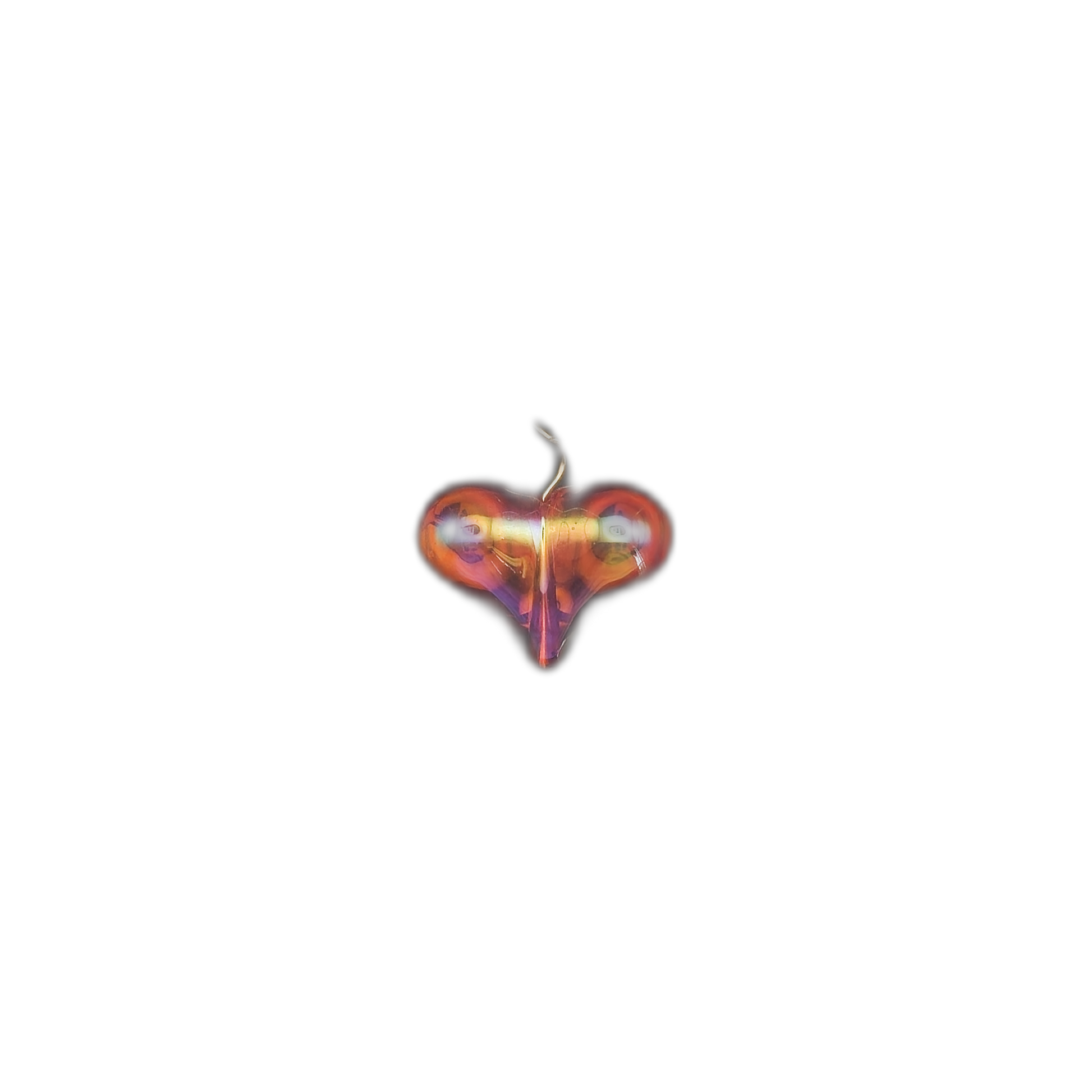 small iridescent glass heart charm centered on a black background