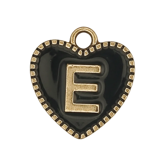 close-up of black heart charm with gold letter E and dotted border