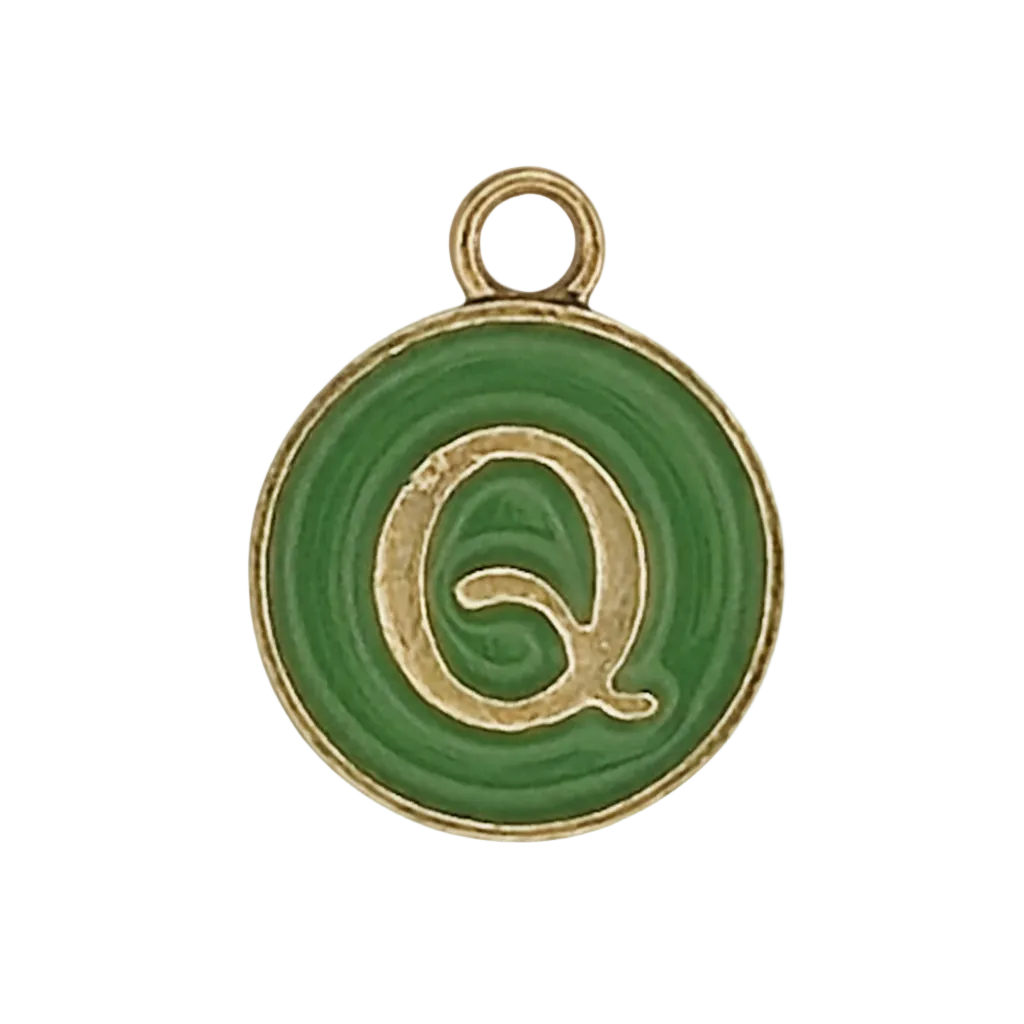 close-up of round green charm with gold letter Q