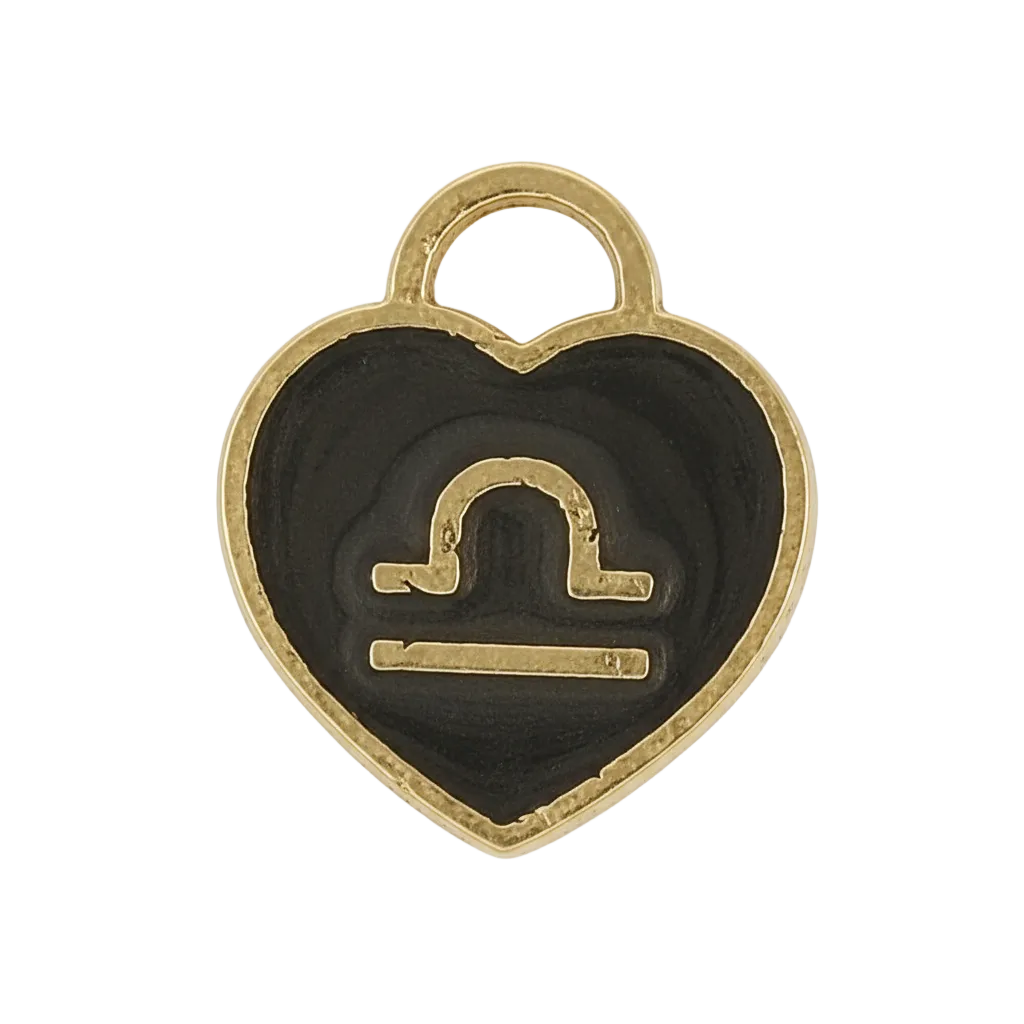 close-up of black and gold heart charm with Libra symbol