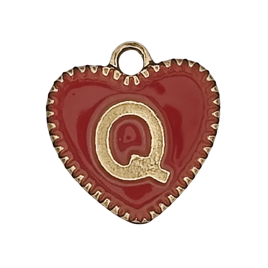 close-up of red enamel heart charm with gold letter Q and dotted gold edge on black background