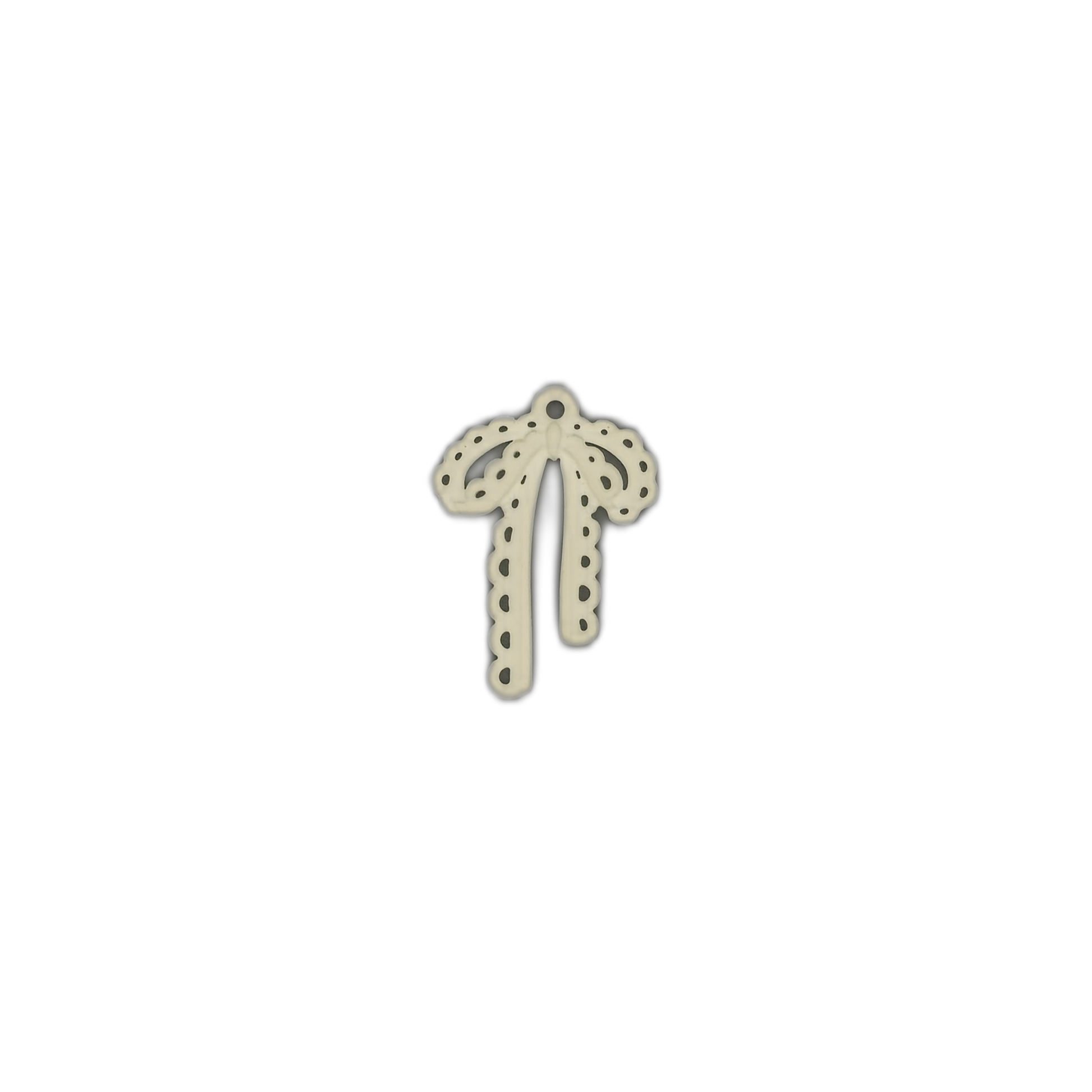 ivory bow cutout charm centered on black background
