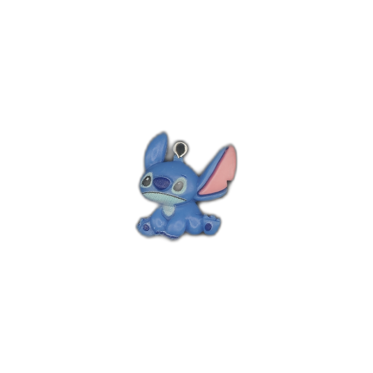 small blue alien character charm centered on a black background