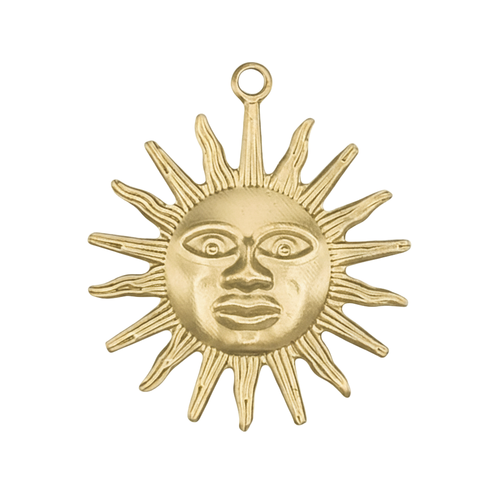 close-up of gold sun face charm with pointed rays on black background