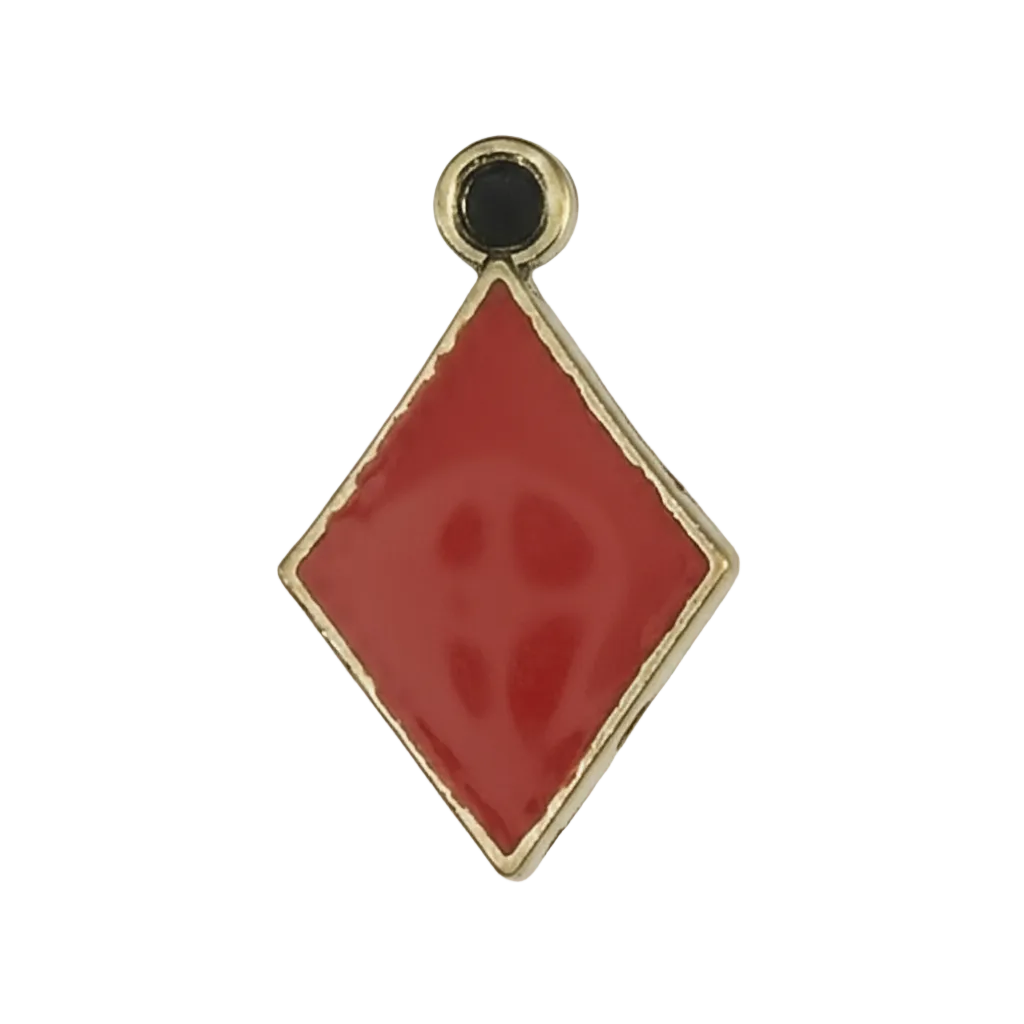 close-up of a red diamond-shaped enamel charm with a gold-tone border on a black background