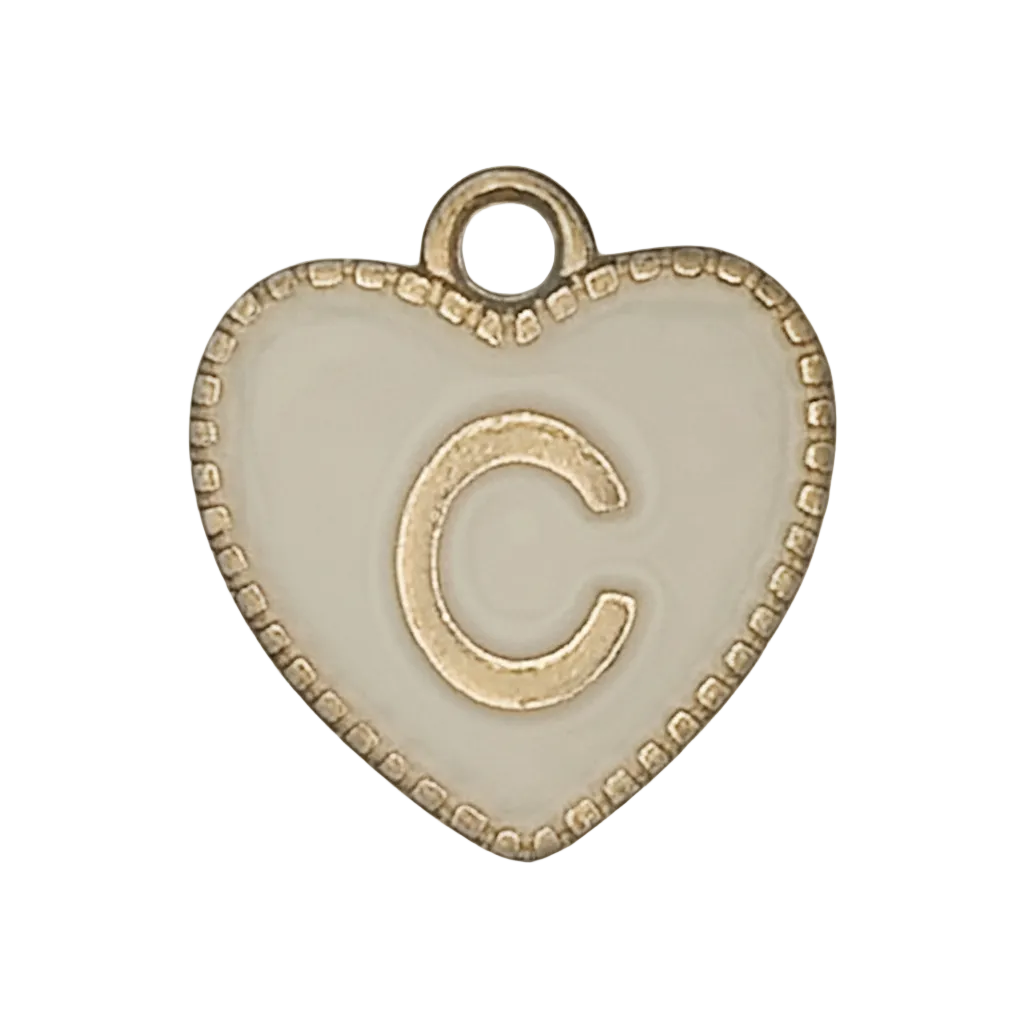 Close-up of a white enamel heart charm with a raised gold-tone letter C and beaded border.