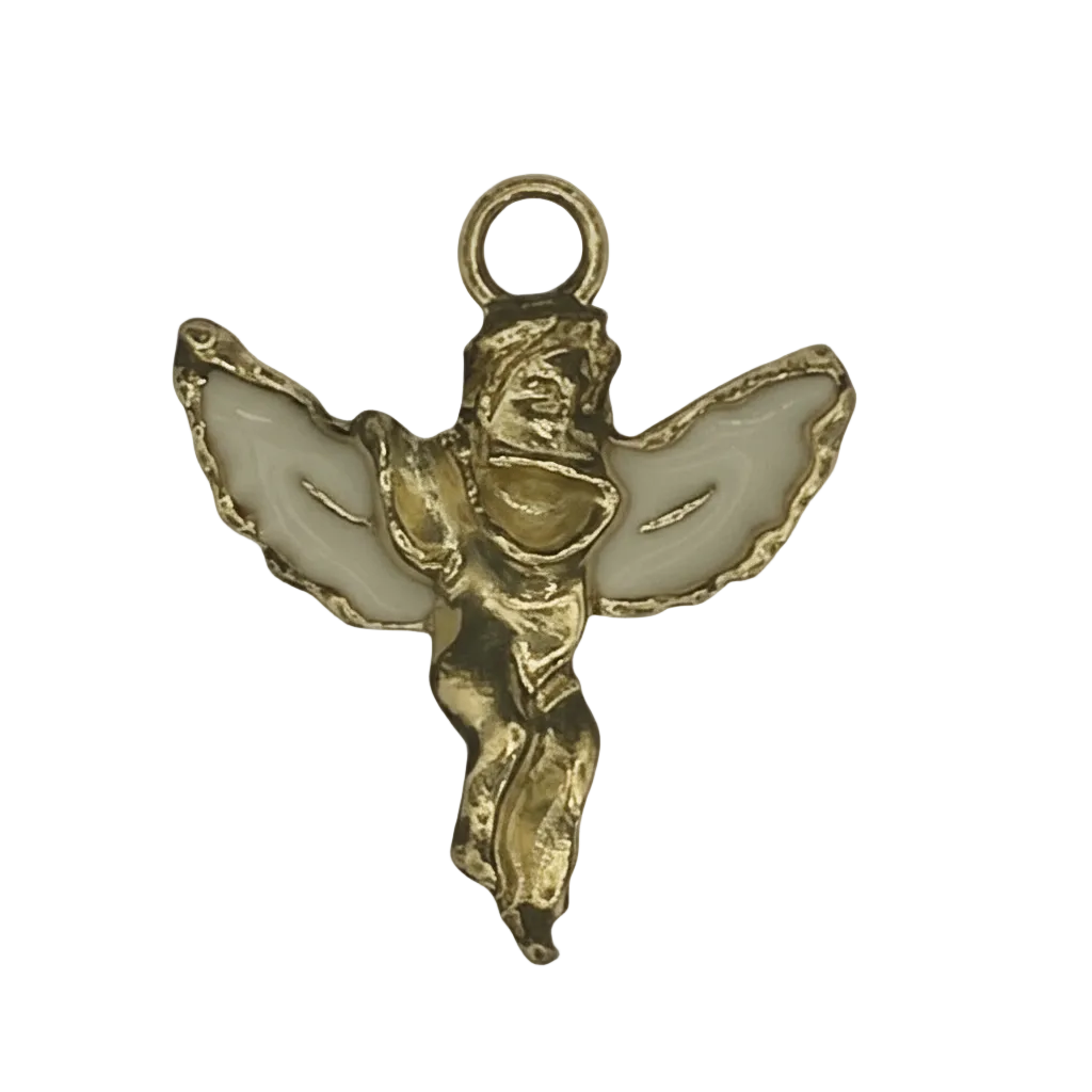 Close-up of a gold-tone angel charm with white enamel wings on a black background.