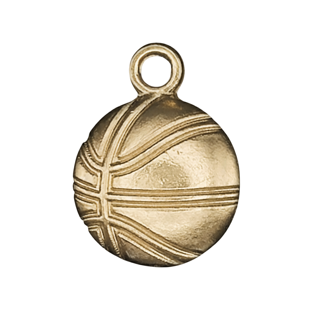 close-up of a gold basketball charm with engraved lines on a black background