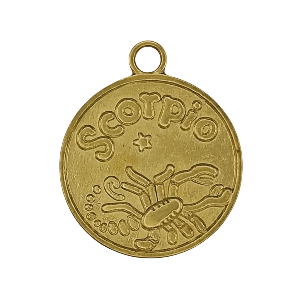 close-up of gold round charm with 'Scorpio' and scorpion engraving