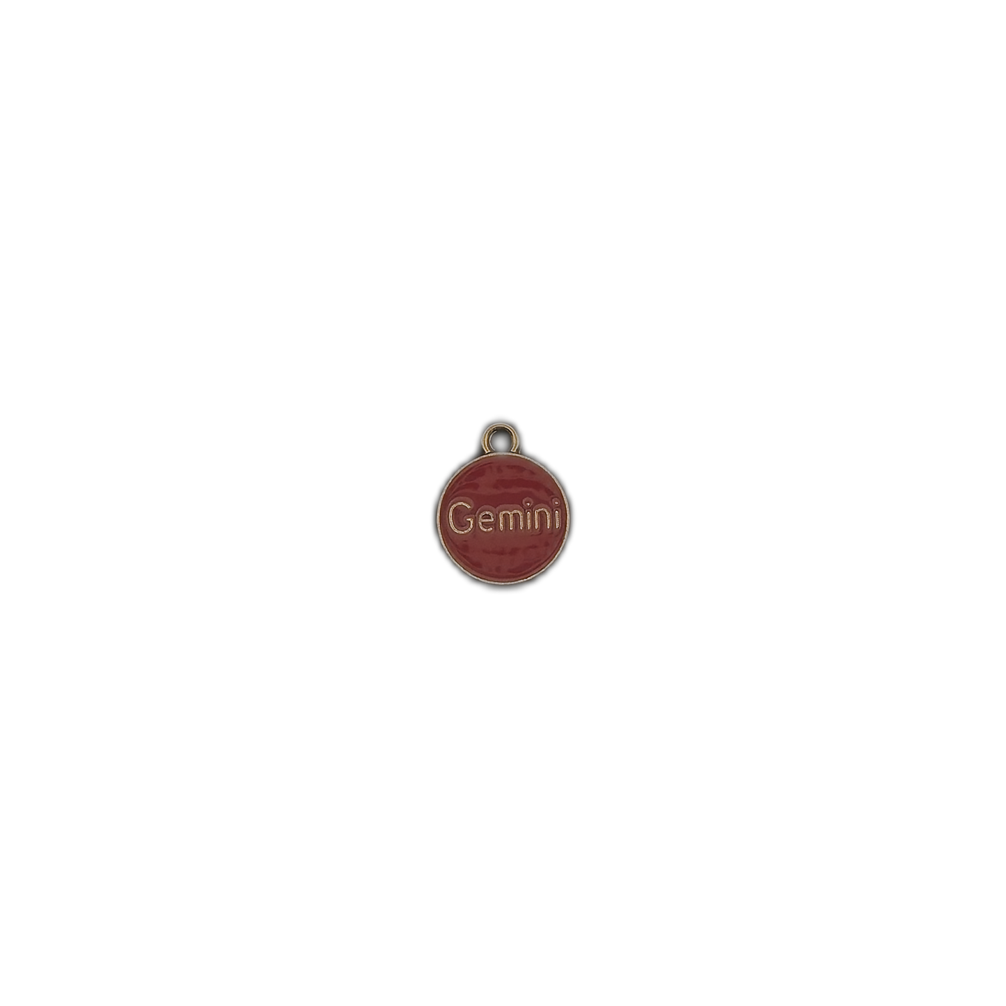 small round red 'Gemini' charm centered on a black background