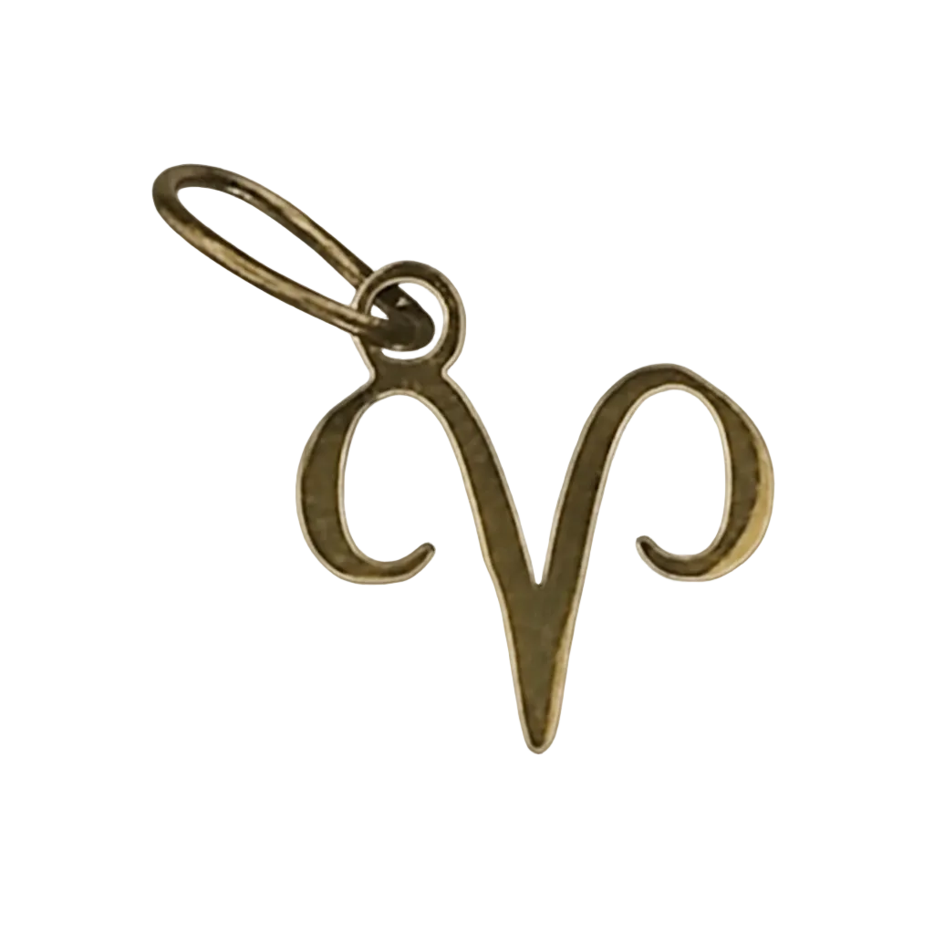 close-up of gold-tone aries zodiac charm