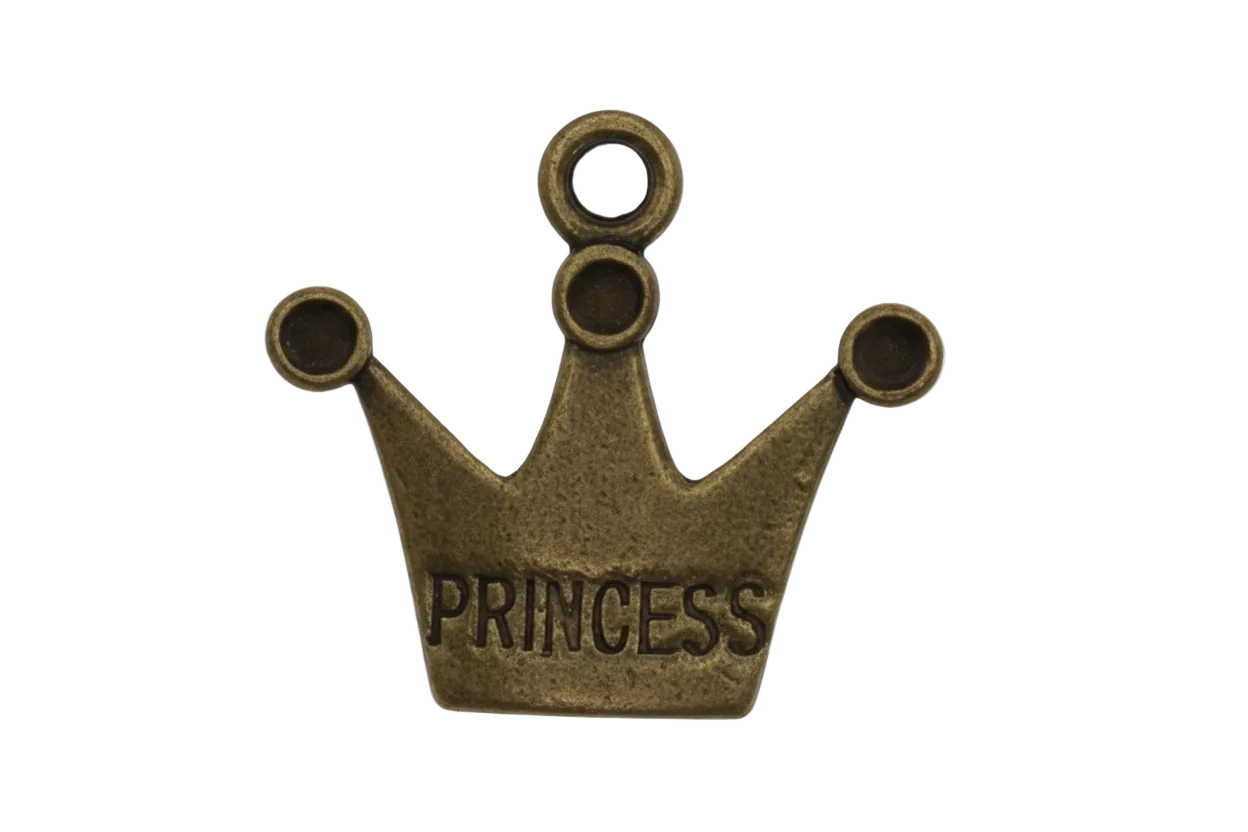 Close-up of an antique brass crown charm engraved 'PRINCESS' on a black background.