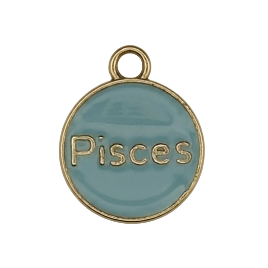 close-up of a round light blue enamel charm with 'Pisces' text and gold edge