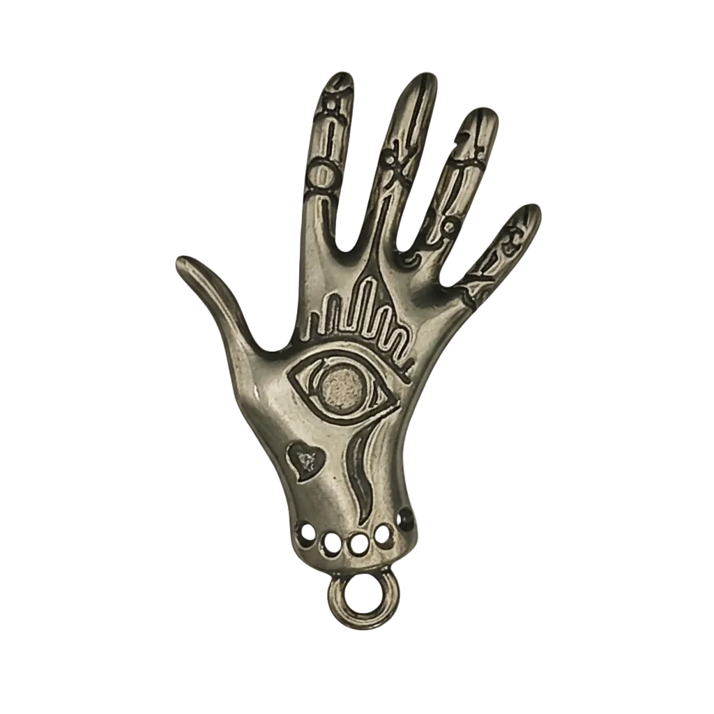 close-up gold-tone hand charm with engraved eye on black background